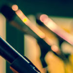 a row of microphones on a stage