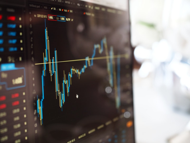 A monitor displaying a financial graph