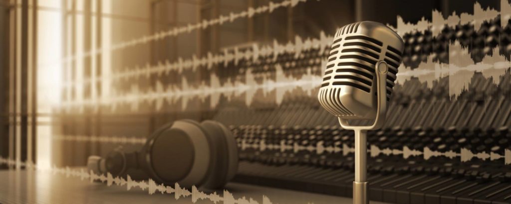 A silver microphone on a desk