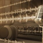 A silver microphone on a desk