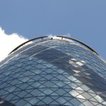 The Gherkin building, bright blue sky