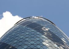 The Gherkin building, bright blue sky