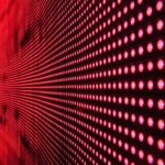Rows of red lights on a black surface