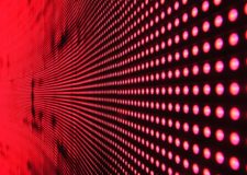 Rows of red lights on a black surface