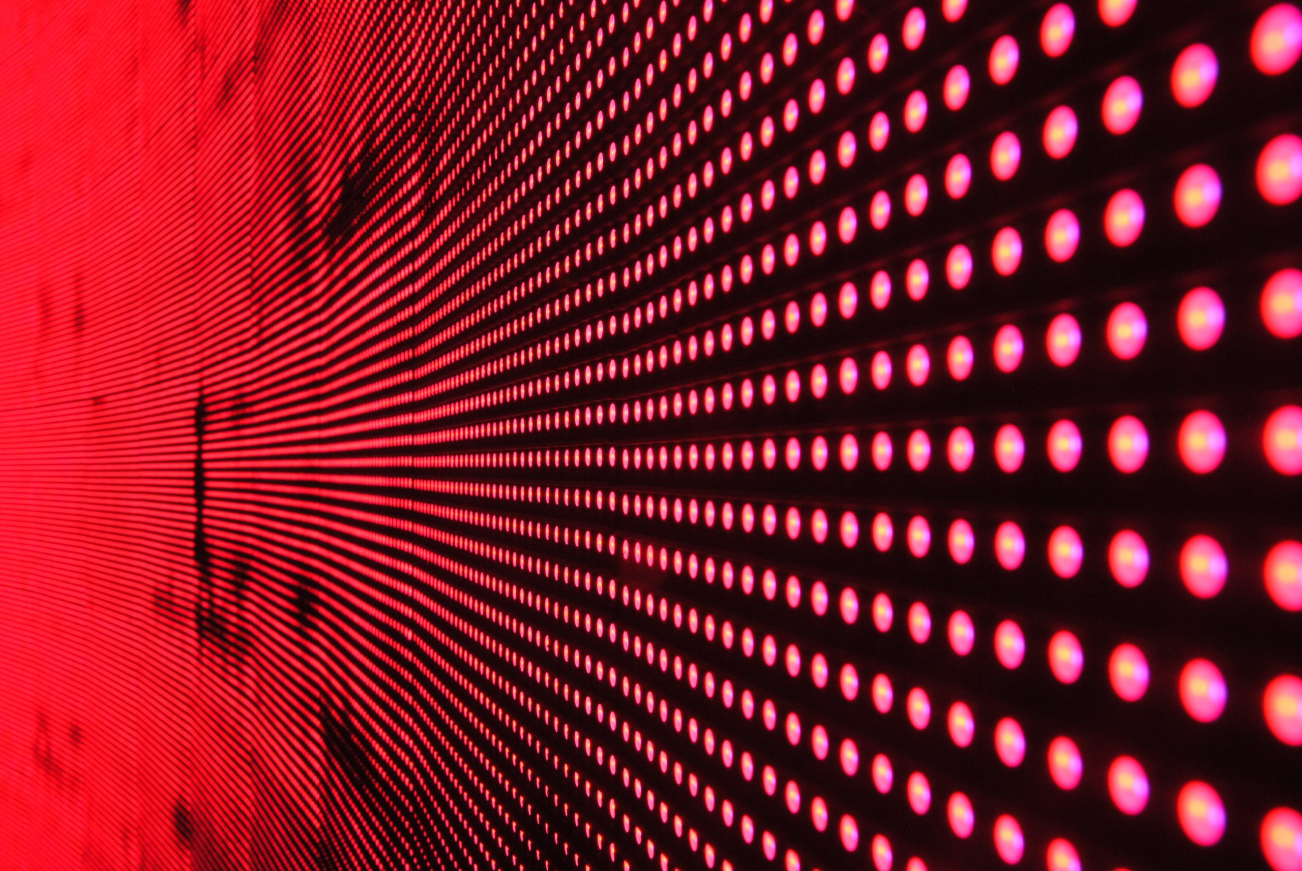 Rows of red lights on a black surface