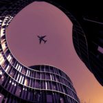 A plane flies over the Axel Towers in Copenhagen, Denmark