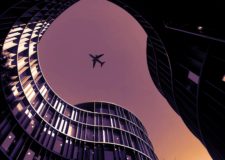 A plane flies over the Axel Towers in Copenhagen, Denmark