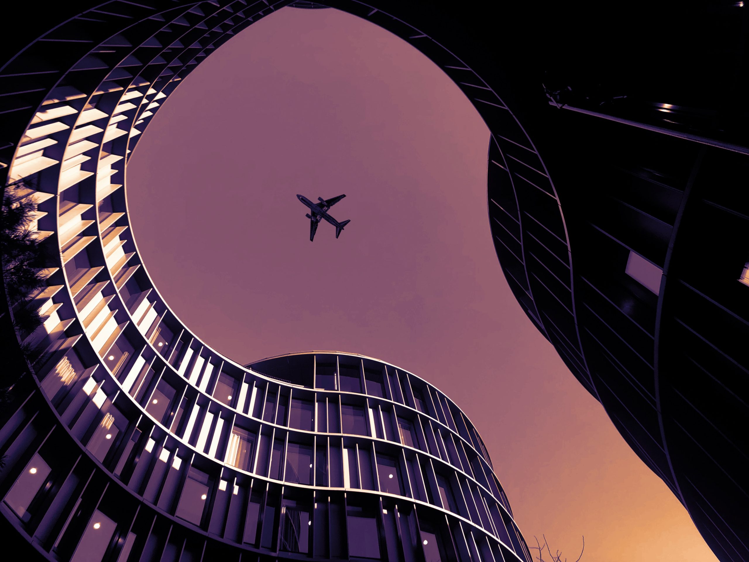 A plane flies over the Axel Towers in Copenhagen, Denmark